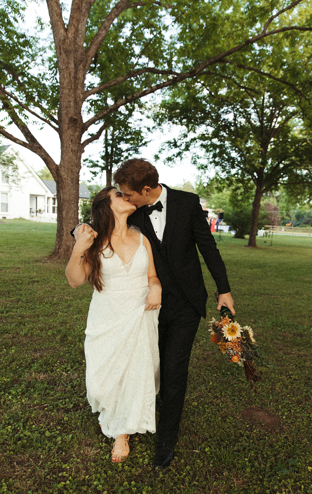 bride and groom kissing photo